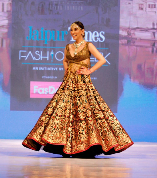 Black and Gold Lehenga with a Cut Out Fringe Blouse.