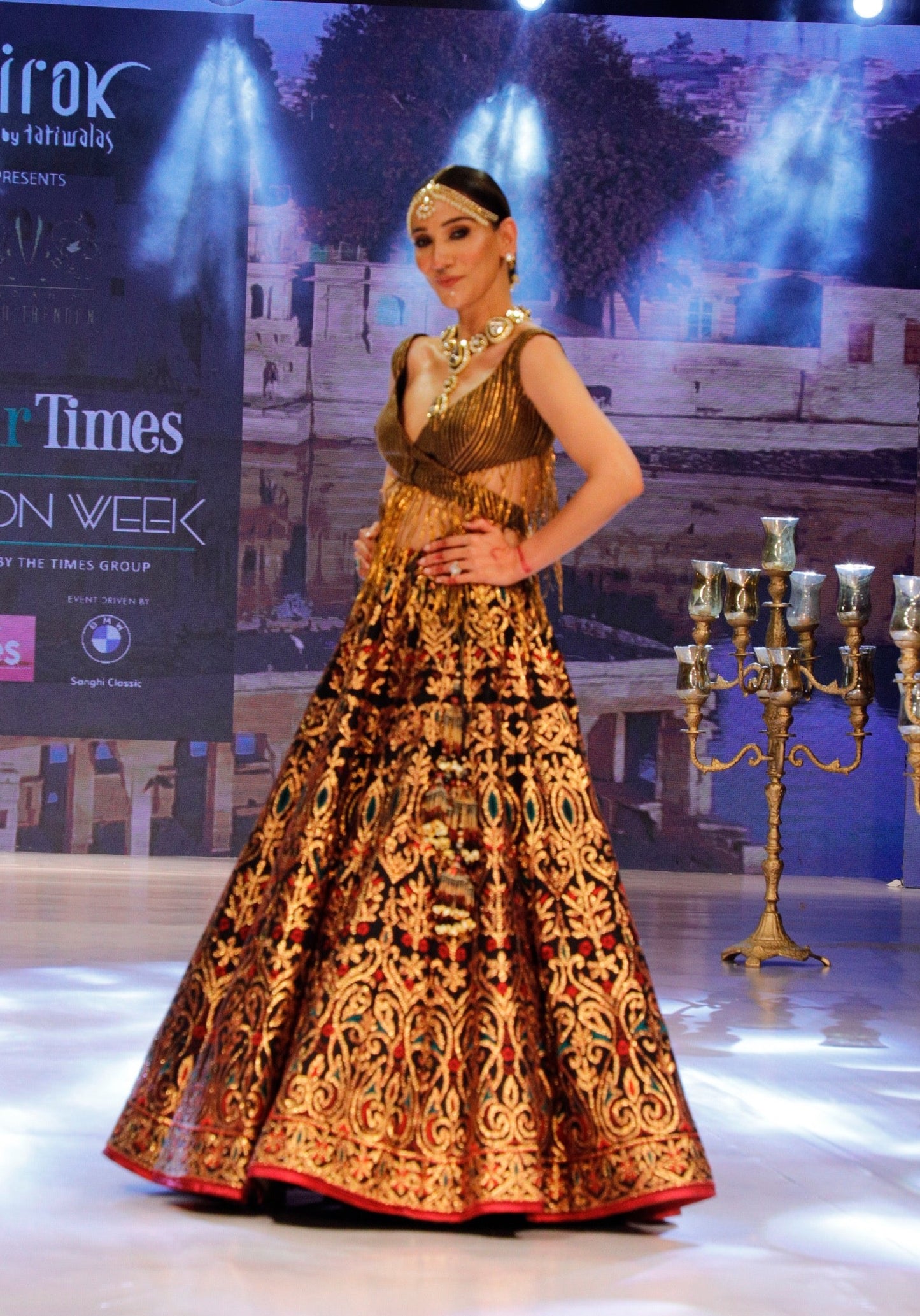 Black and Gold Lehenga with a Cut Out Fringe Blouse.